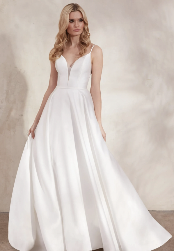 Model wearing a white Allure Women gown